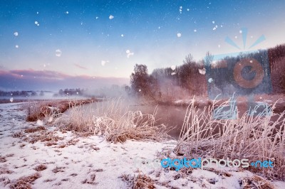 Winter Misty Dawn On The River. Snowflakes, Snowfall. Sunny Wint… Stock Photo