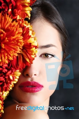 Woman And Flowers Stock Photo