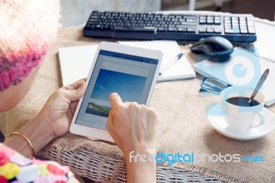 Woman And Tablet Computer In Hand Sliding On Touching Screen Use For People And Lifestyle In Digital Technology Stock Photo