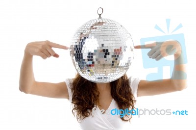 Woman Balancing Mirror Ball With Fingers Stock Photo