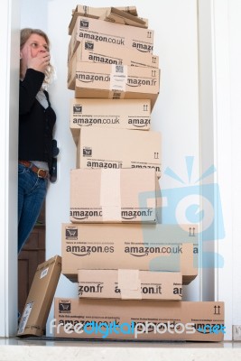 Woman Being Shocked By Amazon.com Delivery Stock Photo