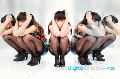 Woman Between Two Mirrors Stock Photo