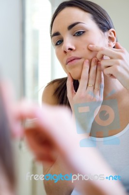 Woman Caring Of Her Beautiful Skin On The Face Standing Near Mir… Stock Photo
