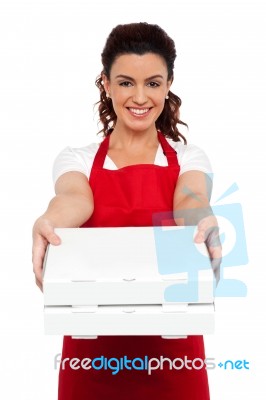 Woman Chef Holding Pizza Box Stock Photo