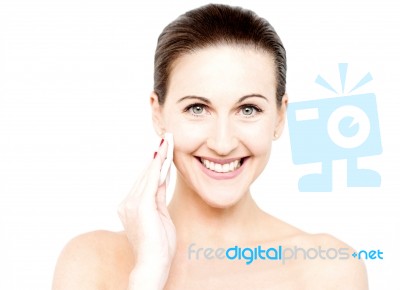 Woman Cleaning Her Face With Cotton Pad Stock Photo