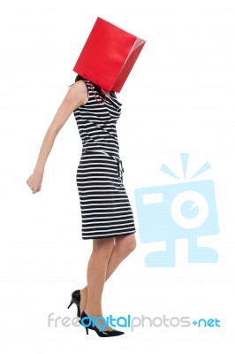 Woman Covering Her Face With Shopping Bag Stock Photo