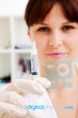 Woman Doctor With Syringe Stock Photo