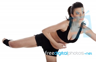 Woman Doing Fitness Exercise In Home Stock Photo