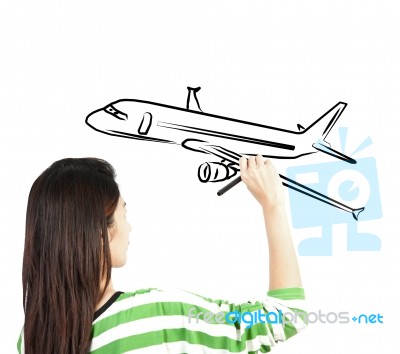 Woman Drawing Plane On Board Stock Photo