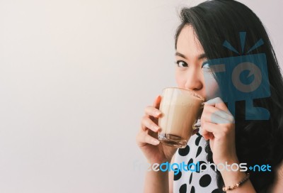 Woman Drinking Hot Latte Coffee At Cafe Stock Photo