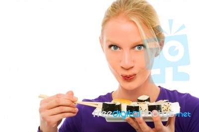 Woman Eating Tray Of Sushi Stock Photo