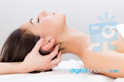 Woman Enjoying Massage At Beauty Spa Stock Photo