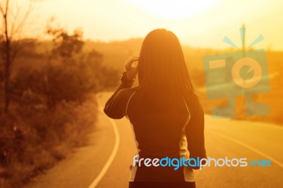 Woman Exercising Outdoor At Sunset  Stock Photo