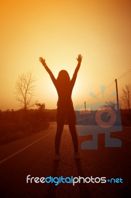 Woman Exercising Outdoor At Sunset  Stock Photo