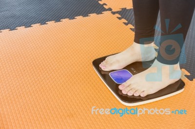 Woman Feet Weighing In Room Stock Photo