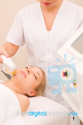 Woman Getting Light Pulsed Hair Removal Treatment Stock Photo