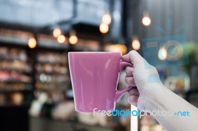 Woman Hand Holding Coffee Cup On Coffee Shop Blurred Background Stock Photo