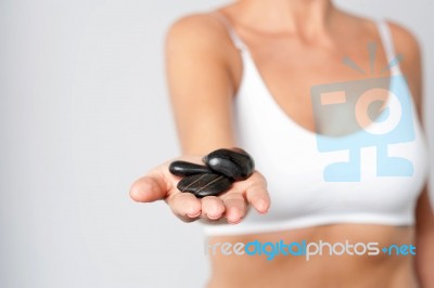 Woman Hand Showing Polished Spa Stones Stock Photo