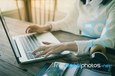 Woman Hand Typing On Laptop Keyboard Stock Photo