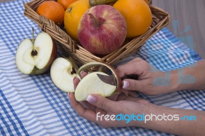 Woman Hands Peeling An Apple With A Knife Stock Photo