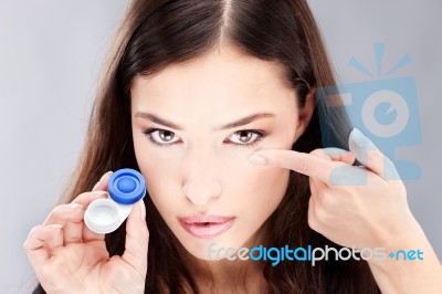 Woman Have Contact Lens On Finger Stock Photo