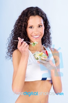 Woman Have Salad On Fork Stock Photo