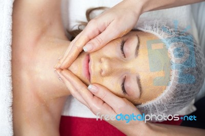 Woman Having Facial Mask At Beauty Salon Stock Photo