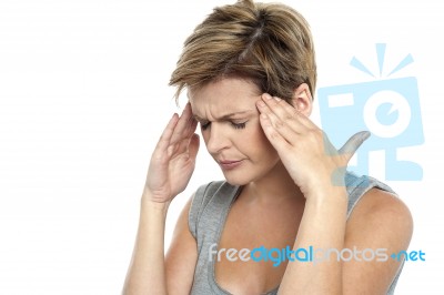 Woman Having Headache. Holding Her Head Stock Photo