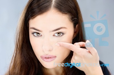 Woman Hold Contact Lens On Finger Stock Photo