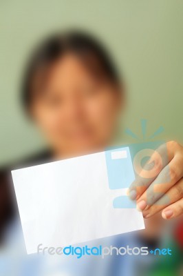 Woman Holding A Card Stock Photo