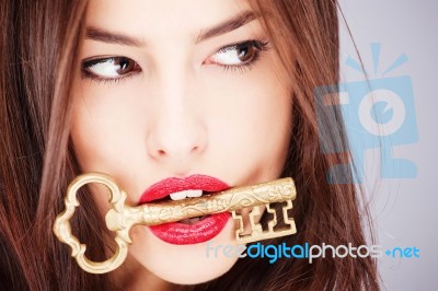 Woman Holding Big Old Key Stock Photo