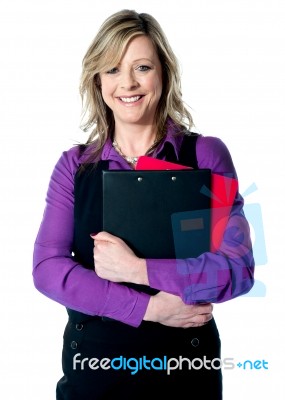 Woman Holding Documents Tightly Stock Photo