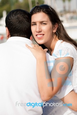 Woman Holding Her Husband Stock Photo