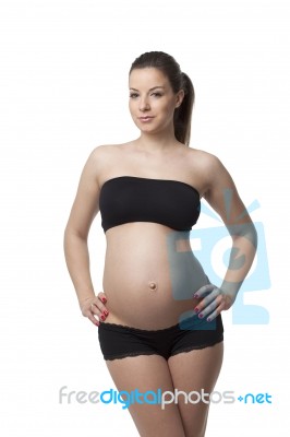 Woman Holding Her Pregnant Belly. White Background Stock Photo Woman Holding Her Pregnant Belly. White Background Stock Photo