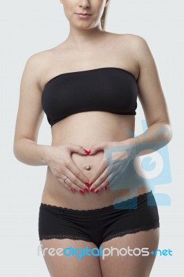Woman Holding Her Pregnant Belly. White Background Stock Photo Woman Holding Her Pregnant Belly. White Background Stock Photo