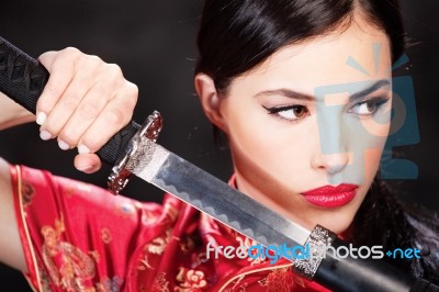 Woman Holding Katana Weapon Stock Photo