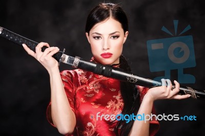 Woman Holding Katana Weapon Stock Photo