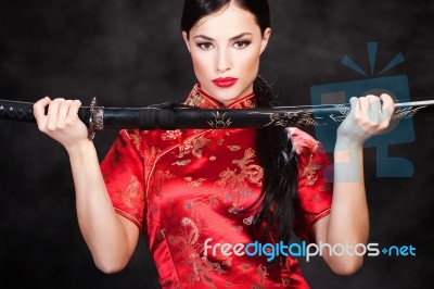 Woman Holding Katana Weapon Stock Photo