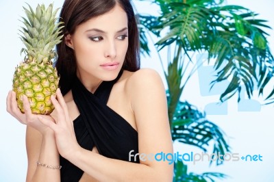 Woman Holding Pineapple Stock Photo