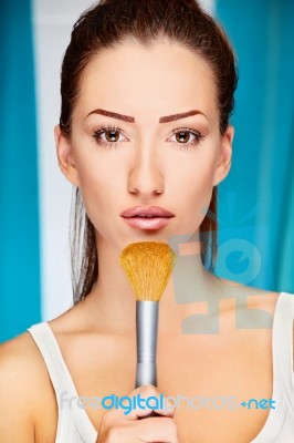 Woman Holding Powder Brush Stock Photo