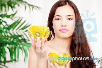 Woman Holding Two Bowl Full Of Fruit Stock Photo
