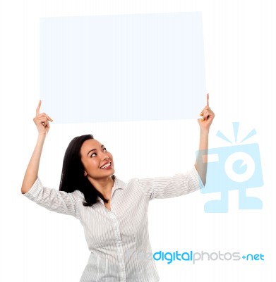 Woman Holding Up A Blank White Billboard Stock Photo