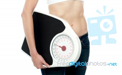 Woman Holding Weighing Scale Stock Photo