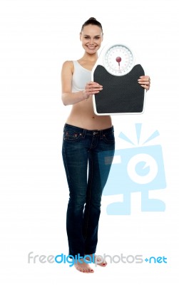 Woman Holding Weighing Scales Stock Photo