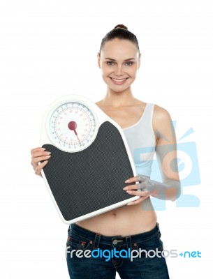 Woman Holding Weighing Scales Stock Photo