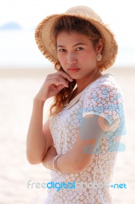 Woman In Beautiful Hat On Beach Stock Photo