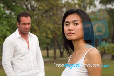 Woman In Front Man Behind Stock Photo