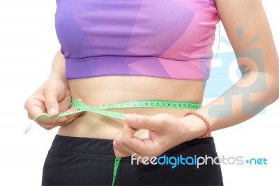 Woman In Sport Bra Measuring Her Body With Tape Isolated On Whit… Stock Photo