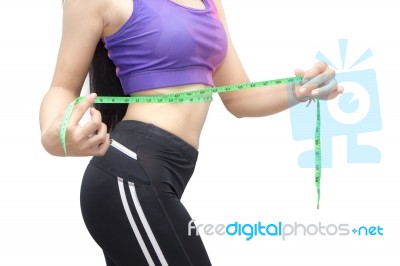 Woman In Sport Bra Measuring Her Body With Tape Isolated On Whit… Stock Photo