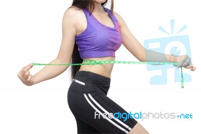 Woman In Sport Bra Measuring Her Body With Tape Isolated On Whit… Stock Photo